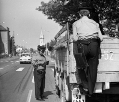 Hungary, Törökszentmiklós, Kossuth Lajos utca, háttérben a református templom., 1976, Magyar Rendőr, cop, crosswalk, Fortepan #66214