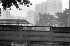 Hungary, Veszprém, elhagyott egykori szovjet katonai bázis. A kerítésen túl a Jutasi úti lakótelep épületei látszanak., 1990, Erdei Katalin, smoking, blocks, Cyrillic alphabet, regime change, Fortepan #76166