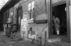 1990, Erdei Katalin, bicycle, poverty, cigarette, pillow, posture, wall tap, drinking fountain, Budapest, inner courtyard, flower box, female figure, poverty, peeking, standing in door, Fortepan #76432