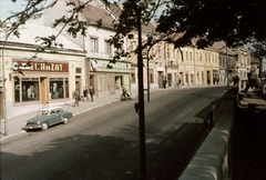 Magyarország, Veszprém, Kossuth Lajos utca az evangélikus templom elöl nézve., 1966, Herth Viktória dr, Bodó Emma, színes, motorkerékpár, élelmiszerbolt, utcakép, automobil, ruhaüzlet, Csemege vállalat, Fortepan #76525