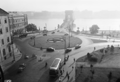 Hungary, Budapest I., Clark Ádám tér és a Széchenyi Lánchíd., 1954, UVATERV, bus, baby carriage, sculpture, commercial vehicle, street view, bus stop, lamp post, Red Star, csibi lamp, automobile, M20 Pobieda, Danube, Tatra T87, fog, Budapest, suspension bridge, William Tierney Clark-design, crosswalk, Fortepan #91978