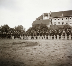 Hungary, Budapest XI., Villányi út 27., a Budai Ciszterci Szent Imre Gimnázium sportpályája, háttérben a szomszédos Kertészeti Akadémia épülete (később Szent István Egyetem, majd Magyar Agrár- és Élettudományi Egyetem, Budai Campus)., 1939, Ebner, school, uniform, kids, scouting, knee snocks, Budapest, Fortepan #92376